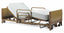 Invacare's IVC Full-Electric Low Bed 5410LOW Bed shown with optional half rails and mattress.